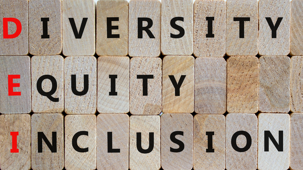 The words diversity, equity, and inclusion spelled out on the ends of wooden blocks.